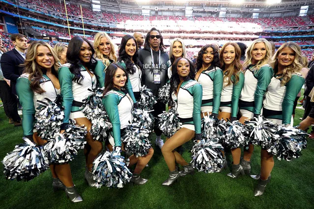 American rapper Jay-Z poses with the Philadelphia Eagles cheerleaders before Super Bowl LVII between the Kansas City Chiefs and the Philadelphia Eagles at State Farm Stadium on February 12, 2023 in Glendale, Arizona. (Photo by Christian Petersen/Getty Images)