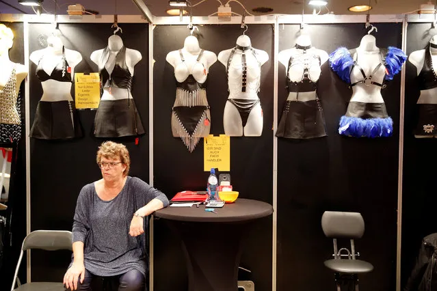 A woman sits in a booth with erotic underwear at the erotic fair “Venus” in Berlin, Germany, October 14, 2016. (Photo by Axel Schmidt/Reuters)