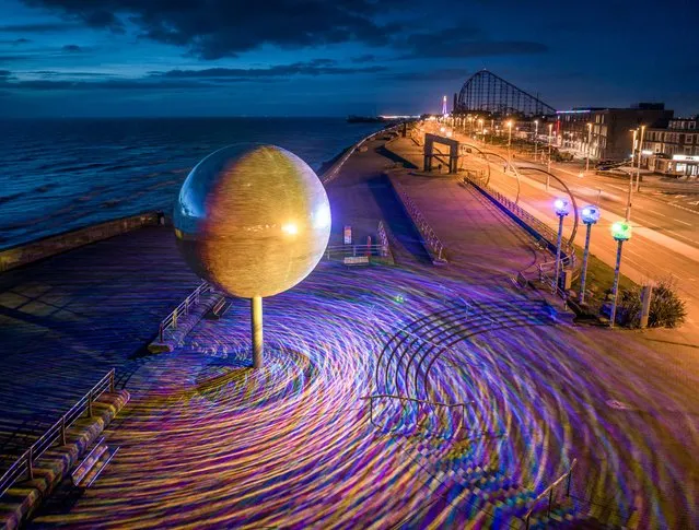 Standalone picture dated March 30, 2023 shows Blackpool's iconic Mirror Ball on the South Promenade, UK – reputed to be the largest in the world – which has just been refurbished. The Mirror Ball, which was created by artist Michael Trainor and measures six metres in diameter, has had six new projectors installed, allowing spectators to see the twinkling landmark lit up at night in a colour-changing light show, using 75 per cent less power than before. The artwork, which features 47,000 mirrors, was inspired by and named after the 1969 Hollywood film, They Shoot Horses Don't They? which features a large Mirror Ball. (Photo by Gregg Wolstenholme/Bav Media)