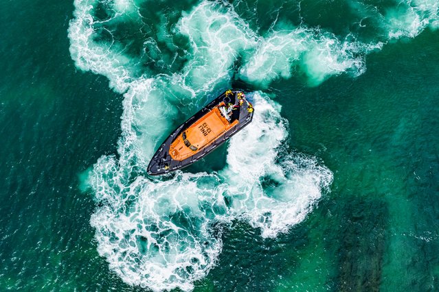 The RNLI Swanage lifeboat in Dorset, UK churns the water as it performs some manoeuvres on September 13, 2025. (Photo by Lewis Johnstone/BNPS)