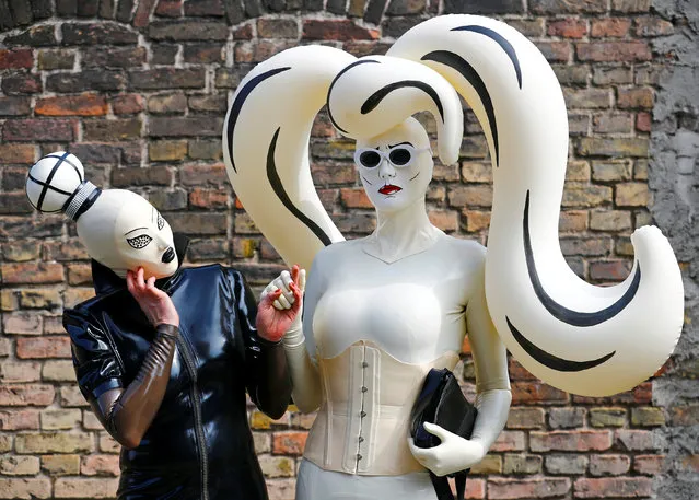 Visitors pose at the “German Fetish Ball” in Berlin, Germany on May 12, 2018. (Photo by Hannibal Hanschke/Reuters)
