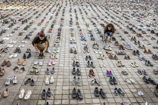 4,500 pairs of shoes are laid out in front of the European Parliament in Brussels ahead of the EU Foreign Affairs Council meeting by AVAAZ members on Monday, May 28, 2018. The AVAAZ campaign, Palestinian Lives Matter, are highlighting the Gaza tragedy with 4,500 pairs of shoes representing one pair for every life lost in this conflict in the last decade, in front of where ministers enter the Parliament building. (Photo by Olivier Matthys/AP Images for AVAAZ)