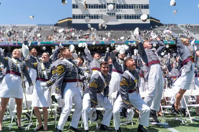 Graduation cadets toss their hats into the air at the end of the 2023 graduation ceremony at the United States Military Academy (USMA), at Michie Stadium in West Point, New York, U.S., May 27, 2023. (Photo by Eduardo Munoz/Reuters)