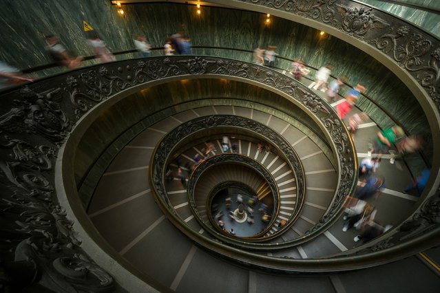 People walk on the double-helix Bramante staircase in the Vatican Museum on Friday, May 2, 2025. (Photo by Christopher Furlong/Getty Images)