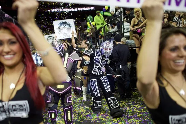 Cheerleaders and characters supporting contestants parade through the Wells Fargo Center before the 23rd annual Wing Bowl in Philadelphia, Pennsylvania January 30, 2015. (Photo by Mark Makela/Reuters)