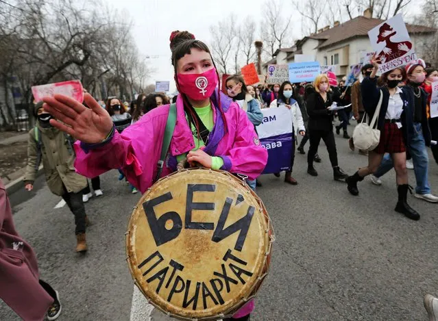 People take part in a march to mark International Women's Day in Almaty, Kazakhstan on March 8, 2021. The sign on a drum reads: “Beat patriarchy”. (Photo by Pavel Mikheyev/Reuters)