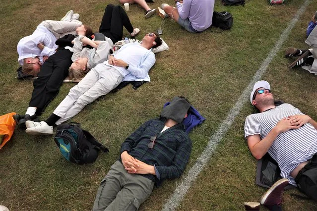 Spectators queue in the Wimbledon Park ahead of day one of The Championships Wimbledon 2023 at All England Lawn Tennis and Croquet Club on July 03, 2023 in London, England. (Photo by Patrick Smith/Getty Images)