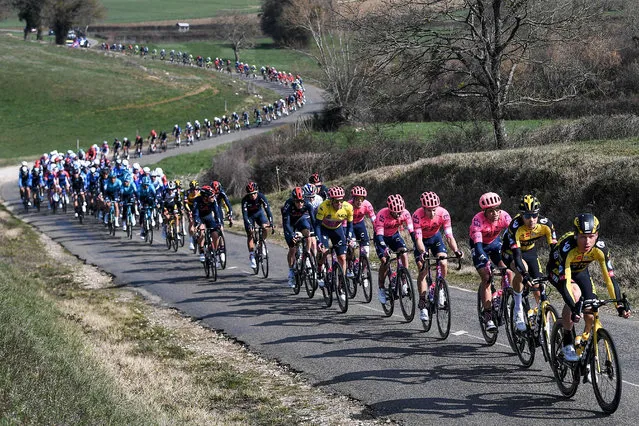 Team Education First rider Switzerland's Stefan Bissegger (C) wearing the overall leader's yellow jersey competes with the pack during the 4th stage of the 79th Paris – Nice cycling race, 187.5 km between Chalon-sur-Saone and Chiroubles, on March 10, 2021. (Photo by Anne-Christine Poujoulat/AFP Photo)