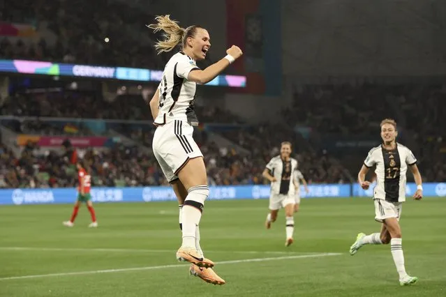 Germany's Klara Buehl, left, celebrates after scoring her side's third goal during the Women's World Cup Group H soccer match between Germany and Morocco in Melbourne, Australia, Monday, July 24, 2023. (Photo by Hamish Blair/AP Photo)
