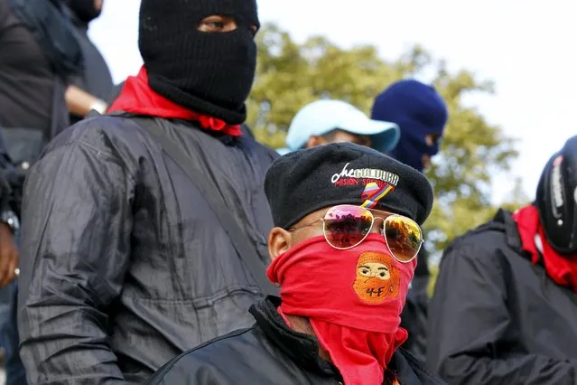 Members of a militant grassroots groups, called "colectivos", who view themselves as the defenders of revolutionary socialism but are denounced by opponents as thugs, are seen outside Miraflores Palace in Caracas, Venezuela, January 5, 2016. (Photo by Christian Veron/Reuters)