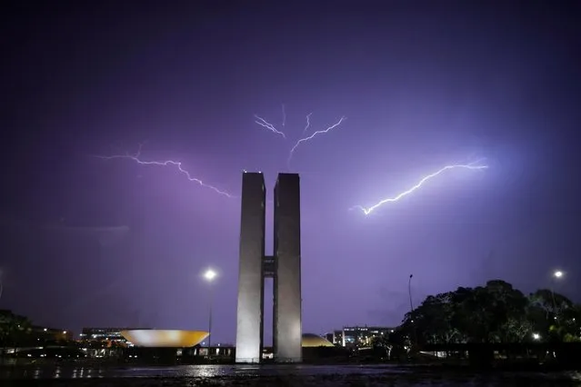 Lightning illuminates the sky above the National Congress in Brasilia, Brazil on February 3, 2021. (Photo by Ueslei Marcelino/Reuters)
