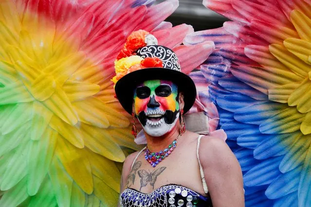 A person participates in the “Santiago Parade 2023”, an LGBTQ community march for diversity in Santiago, Chile on November 11, 2023. (Photo by Sofia Yanjari/Reuters)