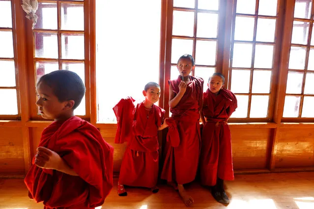 Young monks stand at their school inside Thiksey Monastery in Ladakh, India September 26, 2016. (Photo by Cathal McNaughton/Reuters)