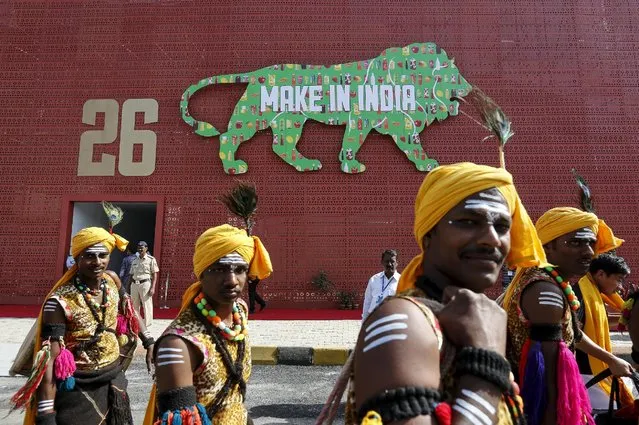 Performers walk at the exhibition centre of the “Make In India” week in Mumbai, India, February 13, 2016. (Photo by Danish Siddiqui/Reuters)