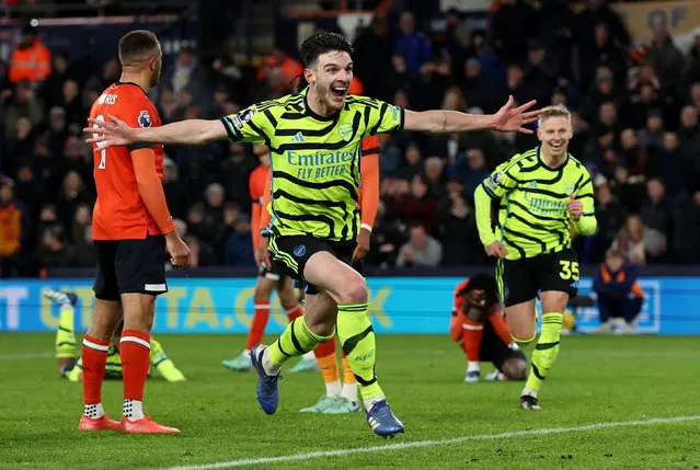 Declan Rice celebrates scoring the 4th Arsenal goal during the Premier League match between Luton Town and Arsenal FC at Kenilworth Road on December 05, 2023 in Luton, England. (Photo by David Klein/Reuters)