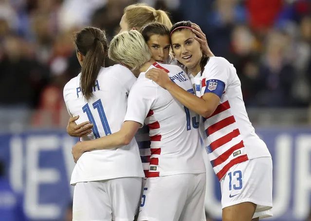 United States' Tobin Heath, second from right, is congratulated on her goal by Mallory Pugh (11), Megan Rapinoe and Alex Morgan (13) during the first half of a SheBelieves Cup soccer match against Brazil Tuesday, March 5, 2019, in Tampa, Fla. (Photo by Mike Carlson/AP Photo)