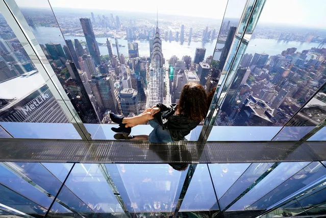 Gina Di Meo, journalist from ANSA sits during a media preview of Summit at One Vanderbilt in New York, October 1, 2021. The Summit viewing deck is spread across the top four floors on One Vanderbilt in Manhattan, the fourth tallest building in the city. (Photo by Timothy A. Clary/AFP Photo)