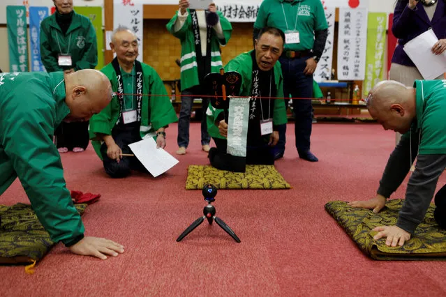 Members of the Bald Men Club, take part in a unique game of tug-of-war by attaching suction pads onto their heads, at a hot spring facility in Tsuruta town, Aomori prefecture, Japan, February 22, 2017. (Photo by Megumi Lim/Reuters)