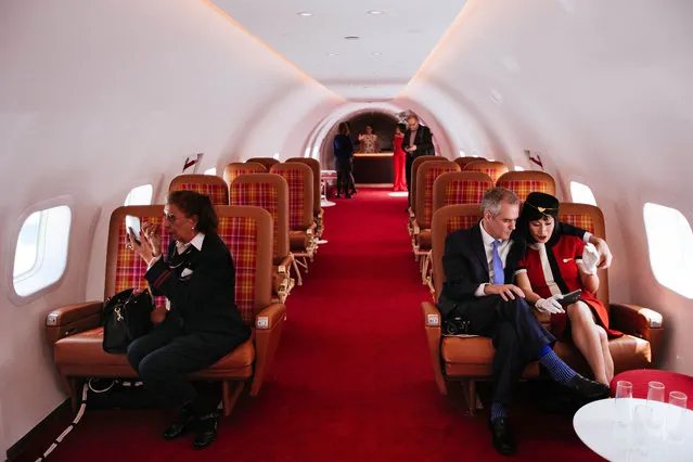 Visitors sit in the cabin of “Connie”, the 1958 Lockheed Constellation airplane restored as a cocktail lounge at the newly opened TWA Hotel at JFK Airport on May 15, 2019 in New York City. The new, 1960's themed hotel built inside the former Trans World Airlines terminal includes high end retail shops, restaurants, and a rooftop bar with runway views. (Photo by Kevin Hagen/Getty Images)