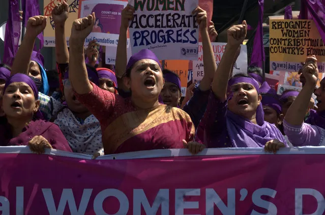 Activists and garment workers shout slogans as they take part in a protest marking International Women’s Day in front of the National Press Club in Dhaka, Bangladesh on March 8, 2024. (Photo by MD Mehedi Hasan/Zuma Press Wire/Rex Features/Shutterstock)