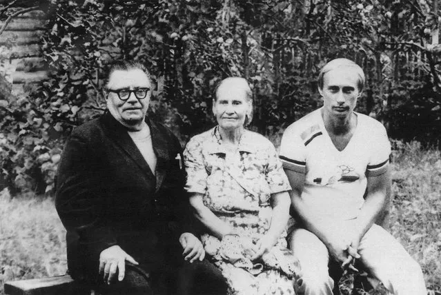 Vladimir Putin, right, poses for a photograph in this file photo with his parents Maria and Vladimir Putin in1985 just before his departure to Germany. (Photo by Laski Diffusion/Newsmakers)