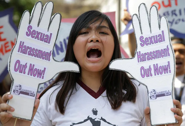 A Filipino student shouts slogans against sexual harassment and alleged increase in cases of violence committed against young women during a rally outside their school in Manila, Philippines, Monday, March 6, 2017. The protest is part of events leading to the March 8 International Women's Day. (Photo by Aaron Favila/AP Photo)