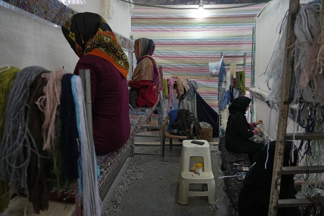 Iranian women weave carpets at a workshop in the city of Kashan, about 152 miles (245 km) south of the capital Tehran, Iran, Tuesday, April 30, 2024. (Photo by Vahid Salemi/AP Photo)
