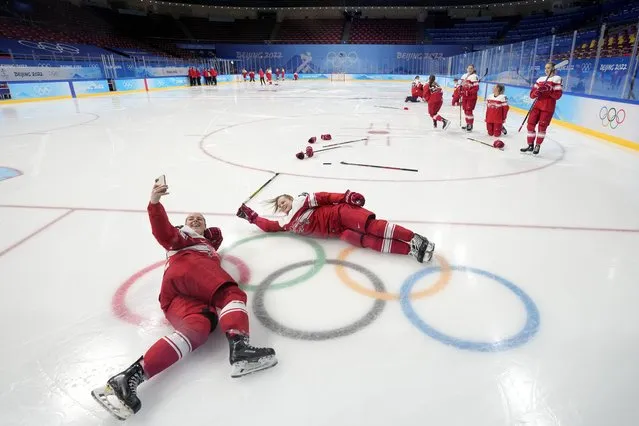 Players of Denmark's women's ice hockey team pose for photo at the 2022 Winter Olympics, Tuesday, February 1, 2022, in Beijing. (Photo by Petr David Josek/AP Photo)