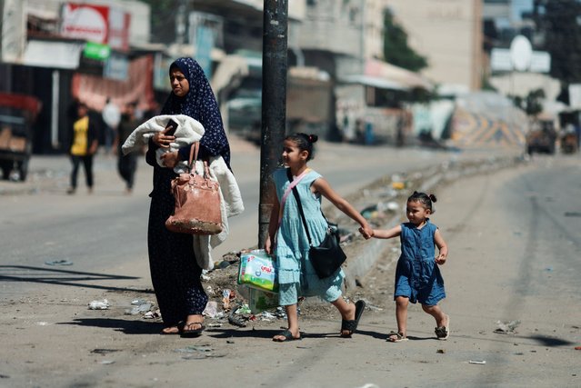 Palestinians flee Rafah after Israeli forces launched a ground and air operation in the eastern part of the southern Gaza City, in Rafah, in the southern Gaza Strip, on May 15, 2024. (Photo by Mohammed Salem/Reuters)