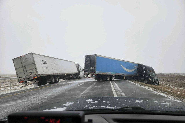 In this photo provided by Nebraska State Patrol, two tractor-trailers lose control on Christmas Day on Interstate 80 in Nebraska as a winter storm pummels part of the Midwest, on Monday, December 25, 2023. Forecasters are predicting that heavy snow and blizzard conditions will continue through early Wednesday across part of the north-central U.S. (Photo by Nebraska State Patrol via AP Photo)