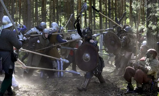Participants re-enact the “Battle of Five Armies” from J.R.R. Tolkien's novel “The Hobbit” in a forest near the town of Doksy, Czech Republic June 6, 2015. (Photo by David W. Cerny/Reuters)