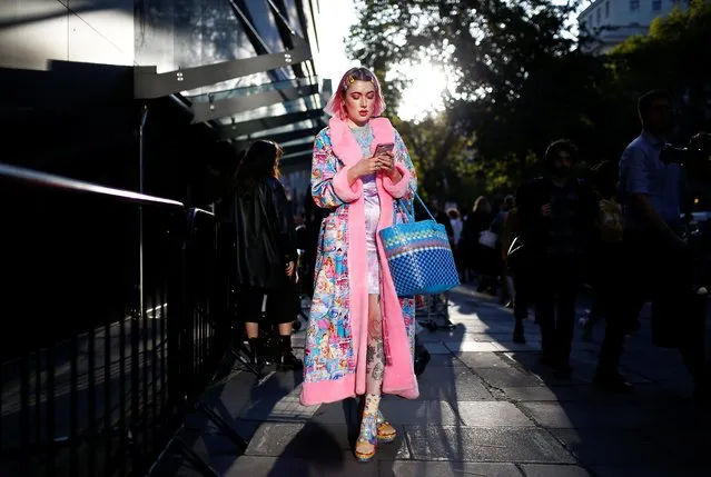 A woman walks outside of a venue at London Fashion Week in London, Britain, September 17, 2019. (Photo by Henry Nicholls/Reuters)