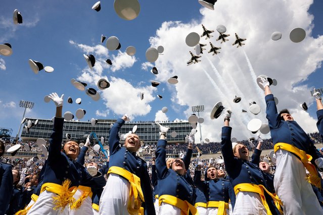 Graduating cadets throw their hats in the air in celebration during the commencement ceremony for graduates of the U.S. Air Force Academy in Colorado Springs, Colorado, U.S., May 30, 2024. (Photo by Kevin Mohatt/Reuters)