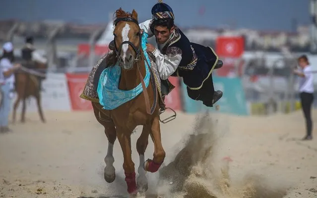 Mounted team of Azerbaijan-Montenegro perform demonstration during the 4th Etnospor Culture Festival held at Ataturk Airport, Istanbul, Turkey on October 04, 2019. The Etnospor Culture Festival is organised for the fourth time at Ataturk Airport by the World Ethnospor Confederation. The Festivals aim is to support traditional sports and convey culture and traditions to the next generations. Visitors can observe ancestor sports in 12 different branch in addition to historic crafts workshops and activities about traditional life. Nearly 1,000 athletes will compete in the festival in 12 traditional sports including archery, oil wrestling, belt wrestling, mounted javelin throwing, mancala and horseback archery. (Photo by Arif Hudaverdi Yaman/Anadolu Agency via Getty Images)