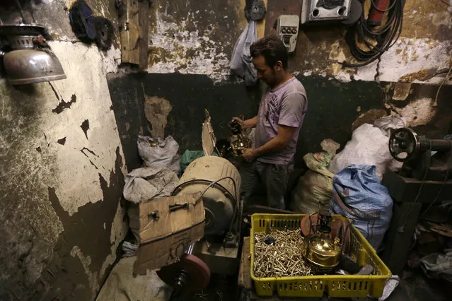 A worker manufacturing primus stoves known as “Bagour” in Arabic, in Cairo, Egypt, May 11, 2016. (Photo by Mohamed Abd El Ghany/Reuters)