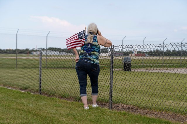 A supporter waits for Republican presidential candidate and former President Donald Trump to arrive on Trump Force One in Milwaukee, Wisconsin on July 14, 2024. (Photo by Cheney Orr/Reuters)