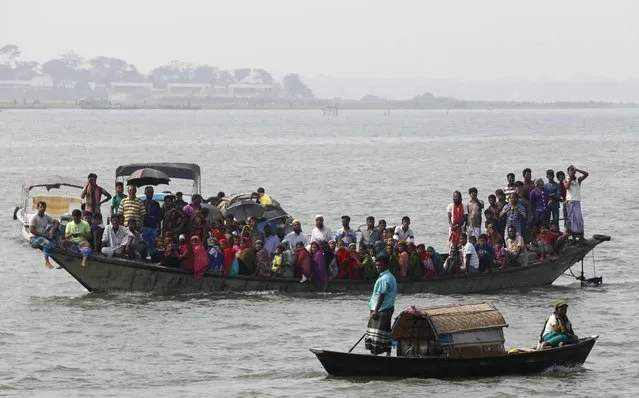 A heavily-laden ferry capsized and sank in central Bangladesh after being caught in a storm, leaving at least 20 people dead and hundreds more missing. Survivors of what is the latest in a string of ferry disasters to blight Bangladesh said the vessel had gone down in a matter of minutes, giving passengers little time to leap to safety. (Photo by Reuters/Stringer)