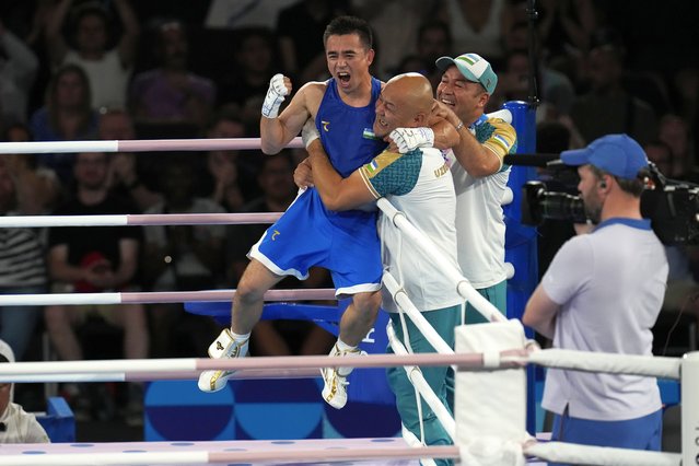 Uzbekistan's Hasanboy Dusmatov reacts after defeating France's Billal Bennama in their men's 51 kg final boxing match at the 2024 Summer Olympics, Thursday, August 8, 2024, in Paris, France. (Photo by Ariana Cubillos/AP Photo)