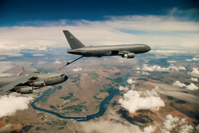 Boeing's KC-46 aerial refueling tanker conducts receiver compatibility tests with a U.S. Air Force C-17 Globemaster III from Joint Base Lewis-McChord, in Seattle, Washington, U.S., July 12, 2016. (Photo by Christopher Okula/Reuters/U.S. Air Force)