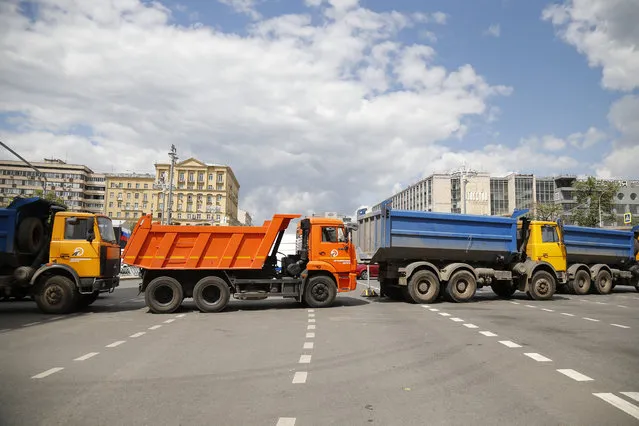 The Tverskaya street is blocked by trucks placed by authorities in downtown Moscow, Russia, Monday, June 12, 2017. Russian opposition leader Alexei Navalny, aiming to repeat the nationwide protests that rattled the Kremlin three months ago, has called for the protest to be moved to Tverskaya street, one of Moscow's main thoroughfares, prompting a massive police presence.  (Photo by Alexander Zemlianichenko/AP Photo)