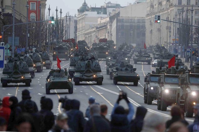 Russian self-propelled artillery vehicles, tanks and military vehicles roll along Tverskaya street toward Red Square during a rehearsal for the Victory Day military parade in Moscow, Russia, Thursday, April 28, 2022. The parade will take place at Moscow's Red Square on May 9 to celebrate 76 years of the victory in WWII. (Photo by AP Photo/Stringer)