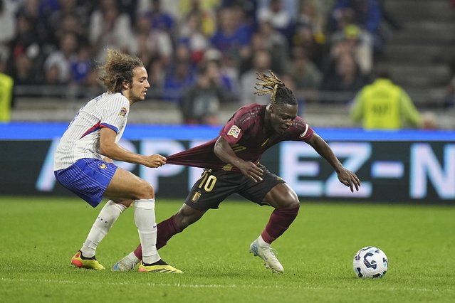 France's Matteo Guendouzi, left, tries to stop Belgium's Jeremy Doku during the UEFA Nations League soccer match between France and Belgium at the Groupama stadium in Decines, outside Lyon, France, Monday, September 9, 2024. (Photo tby Laurent Cipriani/AP Photo)