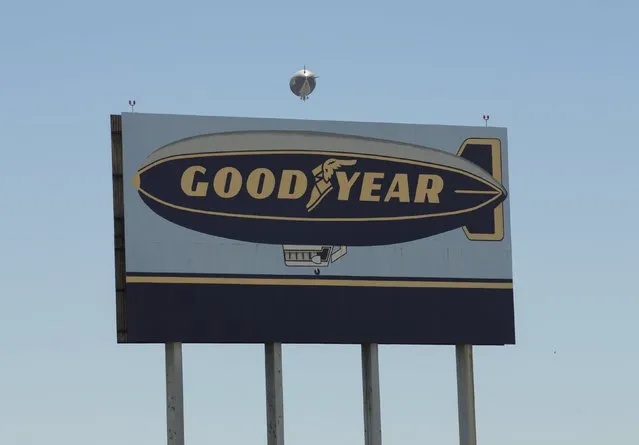 The Goodyear blimp “Spirit of America” floats past a highway billboard  sign in Carson, California August 5, 2015. (Photo by Mike Blake/Reuters)