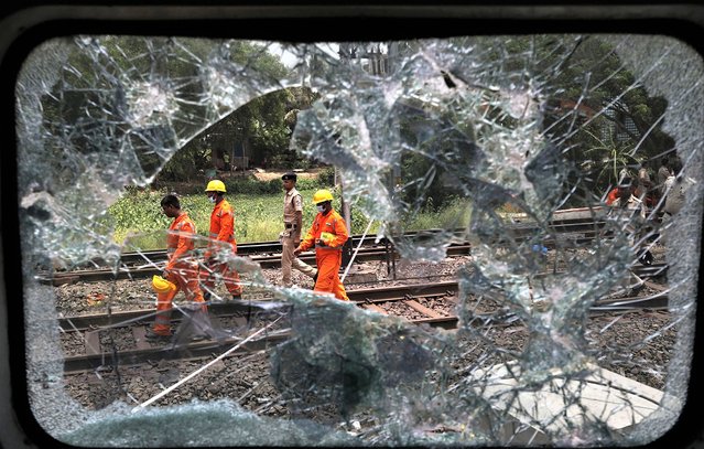 The National Disaster Response Force Rescue continues work at the site of a train accident at Odisha Balasore, India, 03 June 2023. Over 200 people died and more than 900 were injured after three trains collided one after another. According to railway officials the Coromandel Express, which operates between Kolkata and Chennai, crashed into the Howrah Superfast Express. (Photo by Piyal Adhikary/EPA)