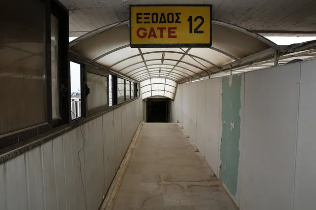 A corridor leading to a passenger gate is seen in the east terminal of the former Athens International airport, Hellenikon June 17, 2014. (Photo by Yorgos Karahalis/Reuters)