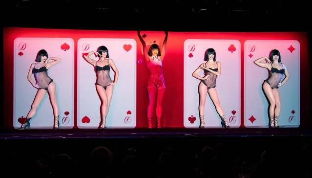 Dancers perform during the “Totally Crazy” show few days after the reopening of the Crazy Horse cabaret, in Paris on October 28, 2021. The Crazy Horse cabaret remained closed for months due to the Covid-19 pandemic. (Photo by Bertrand Guay/AFP Photo)