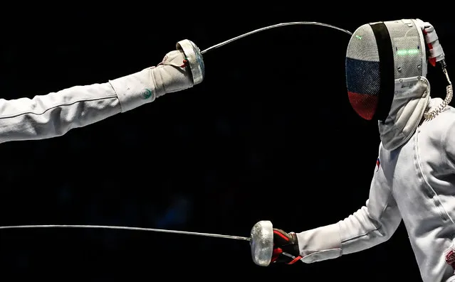 Sergey Khodos (R) of Russia competes against Peter Somfai of Hungary during the third place match between Hungary and Russia for the men's team Epee event at the Fencing World Championships in Leipzig, Germany, 25 July 2017. (Photo by Filip Singer/EPA)