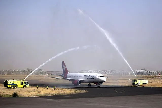 A Yemen Airways plane is greeted with a water spray salute at the Sanaa international airport in Sanaa, Yemen, Monday, May, 16, 2022. The first commercial flight in six years took off from Yemen’s rebel-held capital on Monday, officials said, part of a fragile truce in the county’s grinding civil war. (Photo by Hani Mohammed/AP Photo)