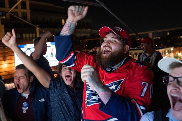 Supporters of Republican presidential nominee former President Donald Trump react to news that Trump won the state of Georgia during a watch party in Washington, Wednesday, November 6, 2024. (Photo by Nathan Howard/AP Photo)
