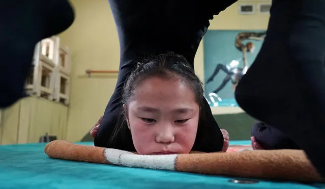 A young contortionist practices at a training school in Ulaanbaatar, Mongolia, July 4, 2016. (Photo by Natalie Thomas/Reuters)